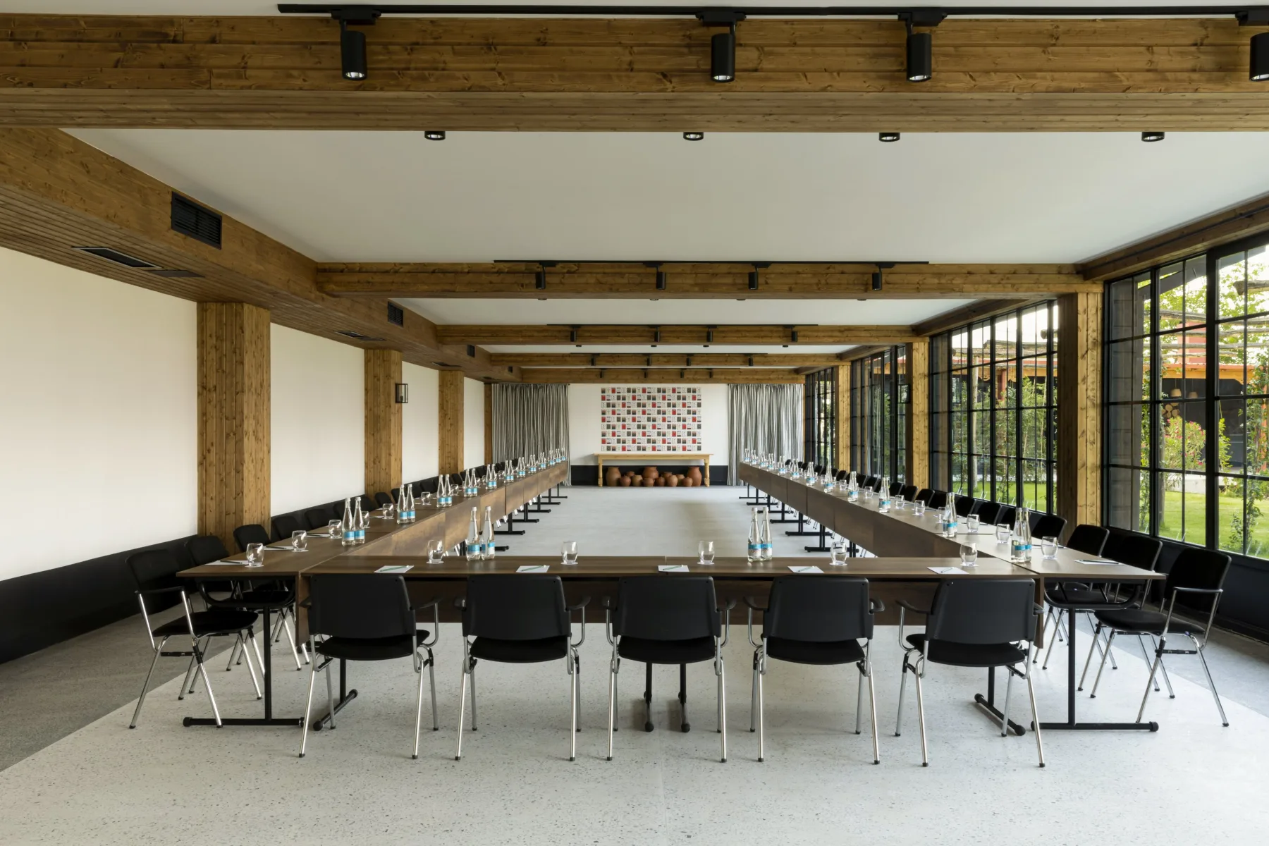 Representative hotel space: A conference room with long tables and rows of chairs.