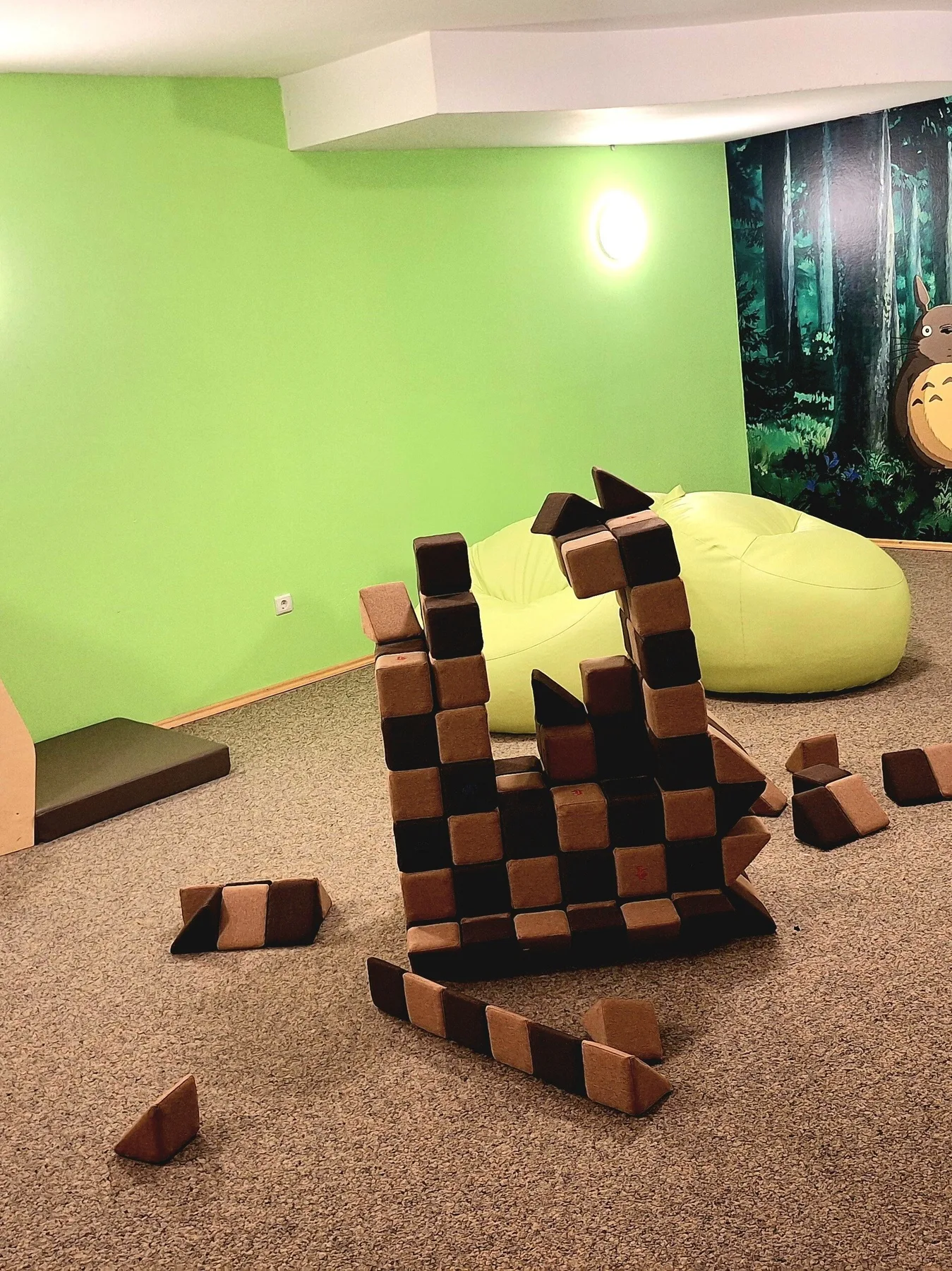 Representative hotel space: A playroom with oversized foam blocks and a yellow beanbag.