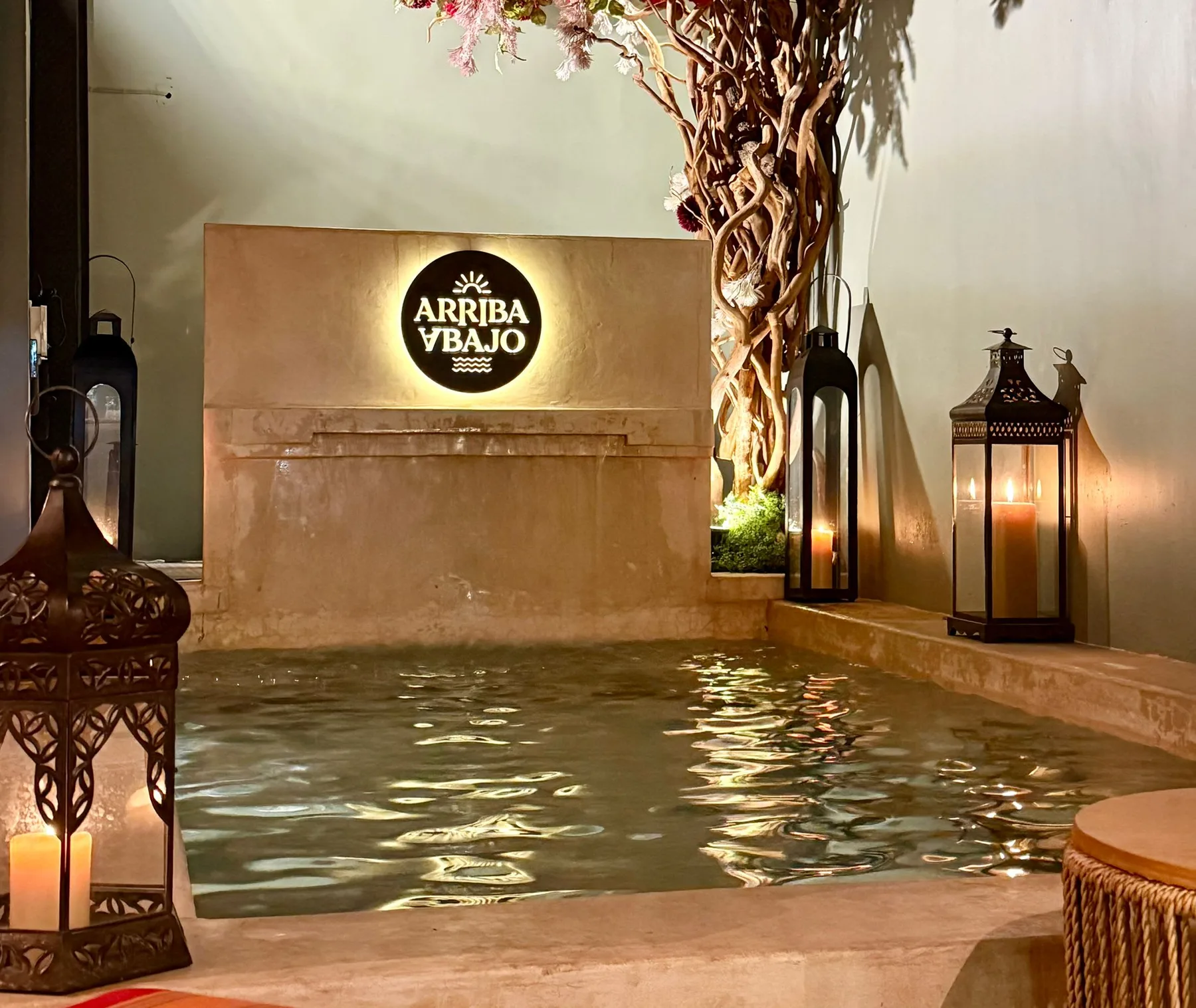 Shared amenity: An indoor pool sits beside a stone feature wall and decorative lanterns.