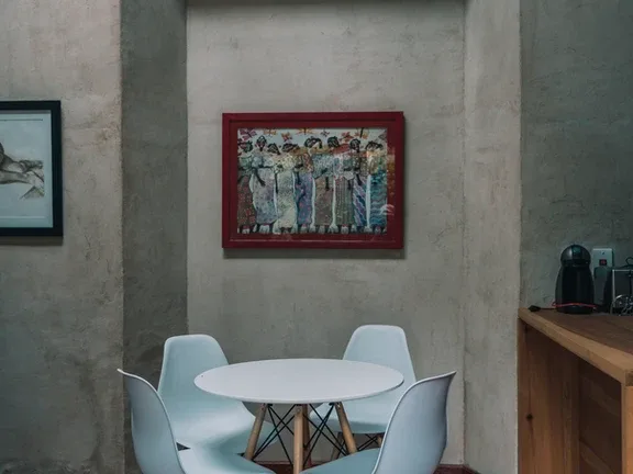 Representative hotel space: A small dining area with a round table and white seating.