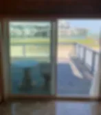 Representative hotel space: A room opens onto a balcony overlooking a green landscape.