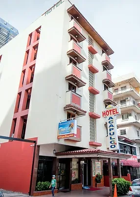 Representative hotel space: A hotel exterior with balconies and a street-level entrance.