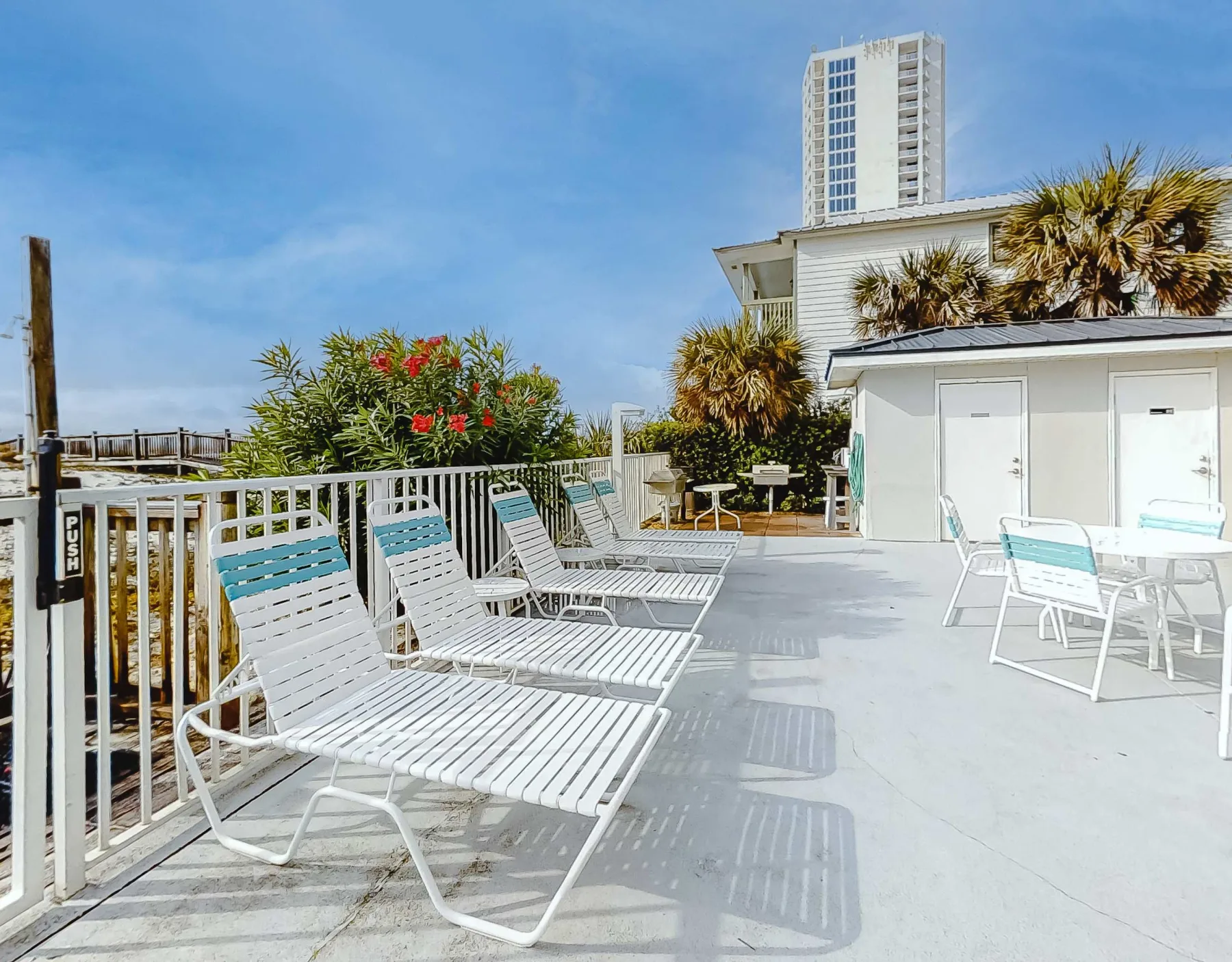 Shared amenity: An outdoor rooftop terrace with lounge seating and potted greenery.