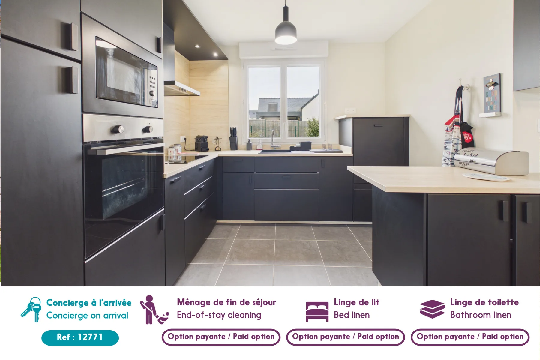 A modern kitchen with dark cabinets, built-in appliances, and a central work area.