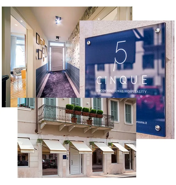 Representative hotel space: A hotel hallway with framed pictures and a door at the end.