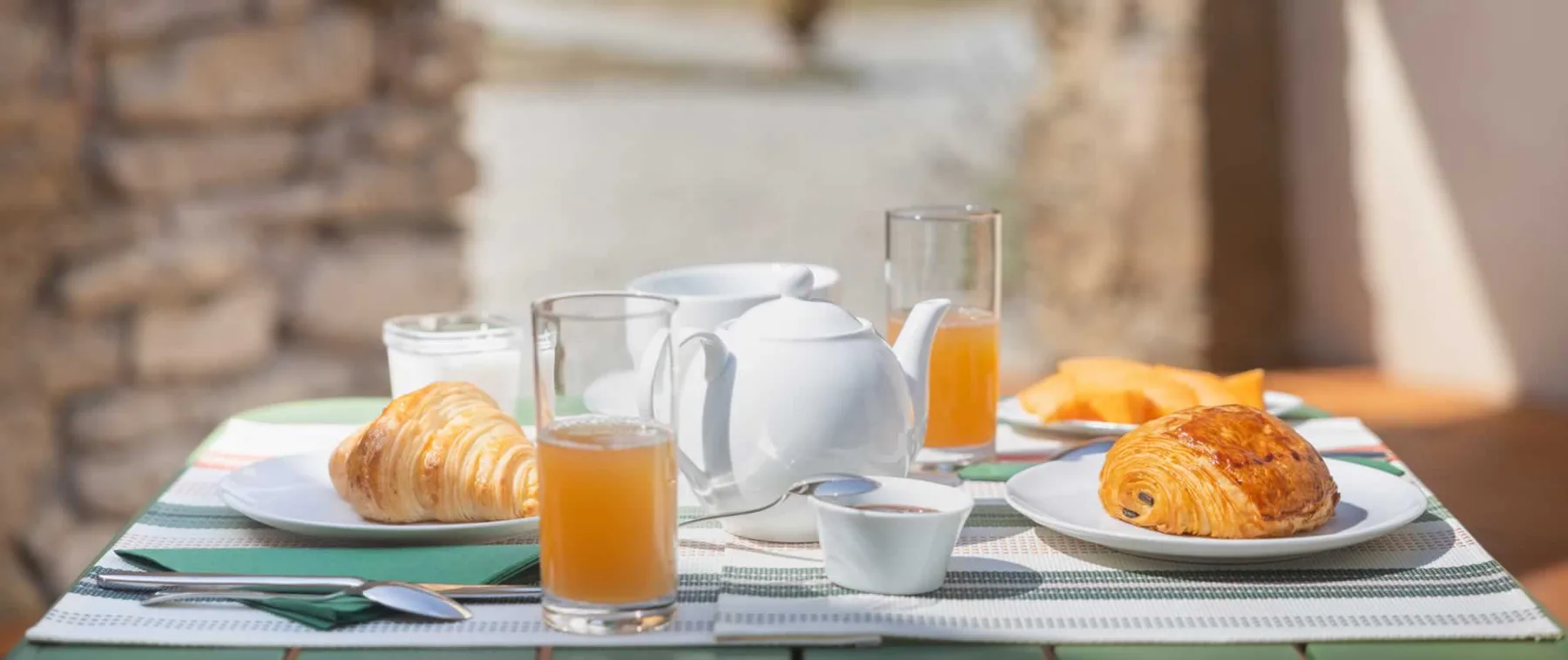Representative hotel space: Breakfast is set on a table with pastries and drinks.