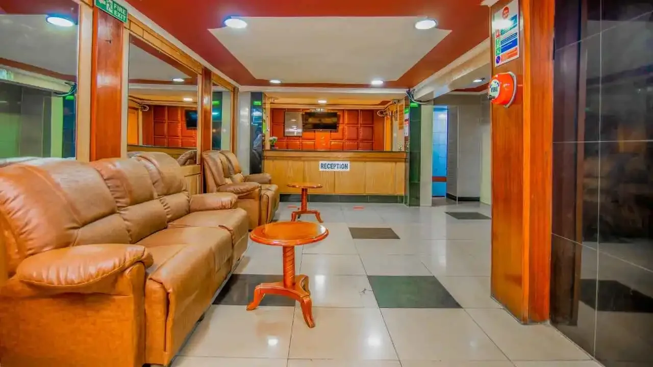 Representative hotel space: A hotel lobby with leather seating and a reception desk.