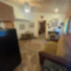 Representative hotel space: A hotel room with seating and a table.