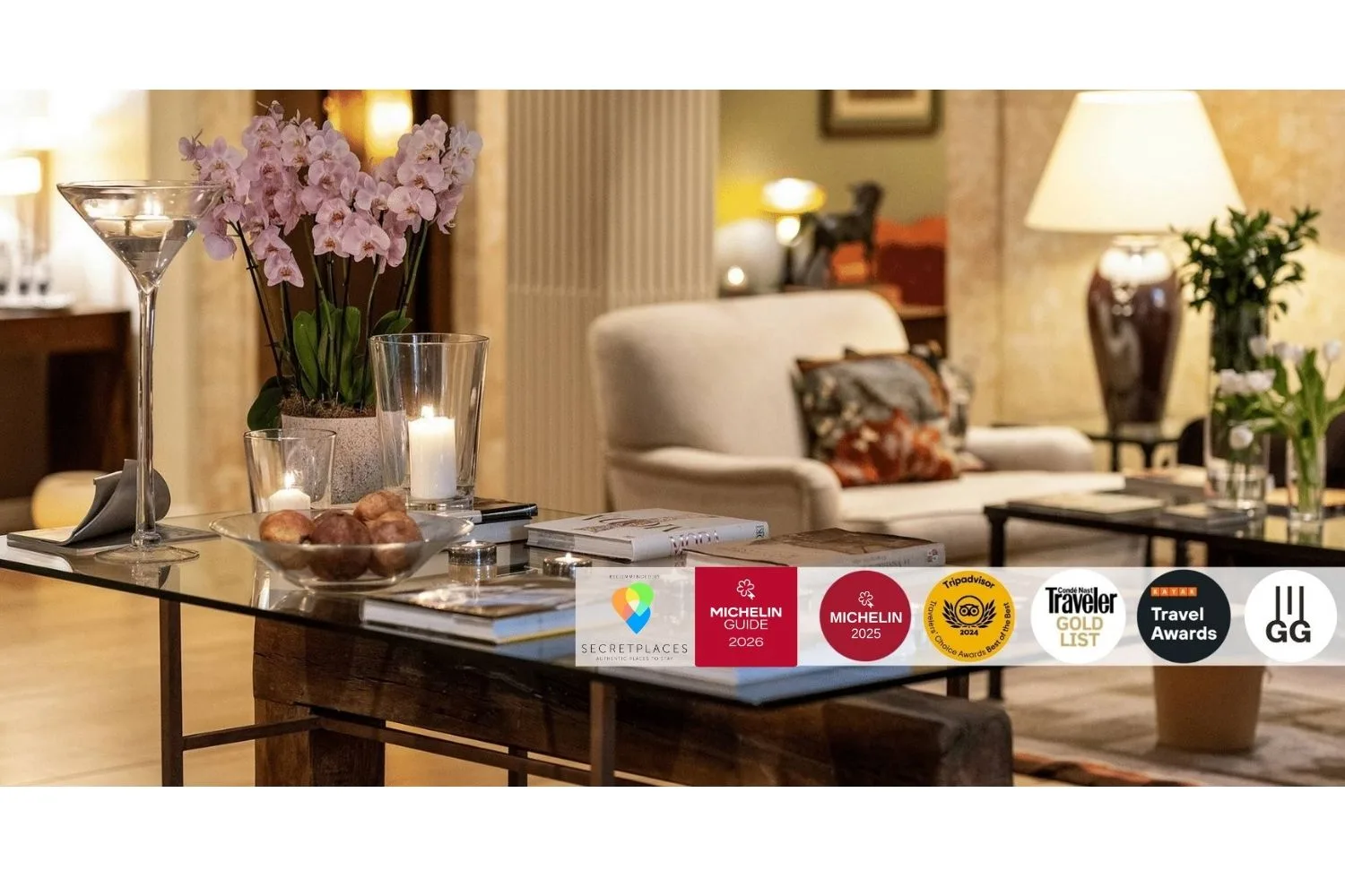 Representative hotel space: A hotel lounge with a glass coffee table, flowers, and seating.