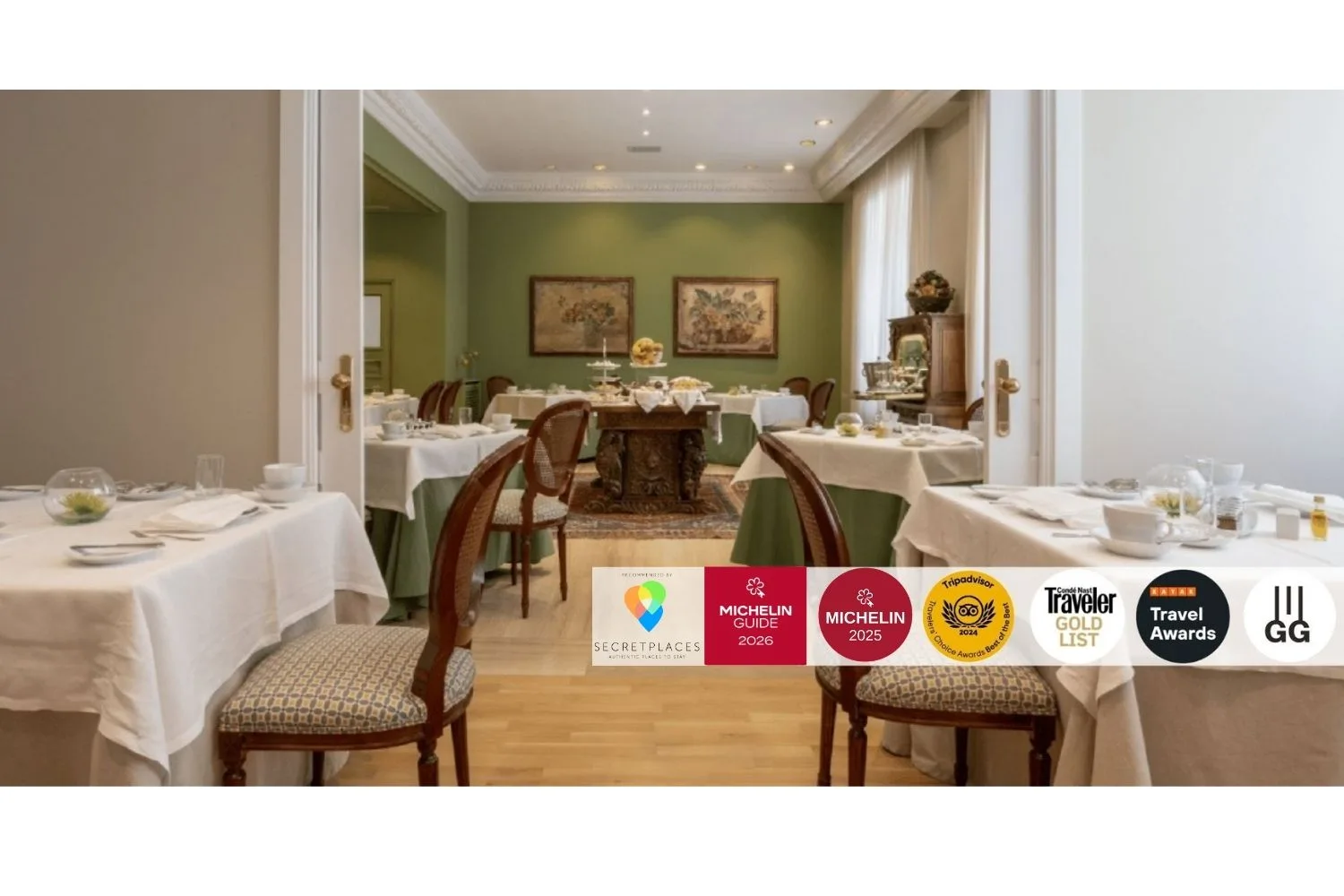 Representative hotel space: A dining room with tables set for a meal and framed artwork on the walls.