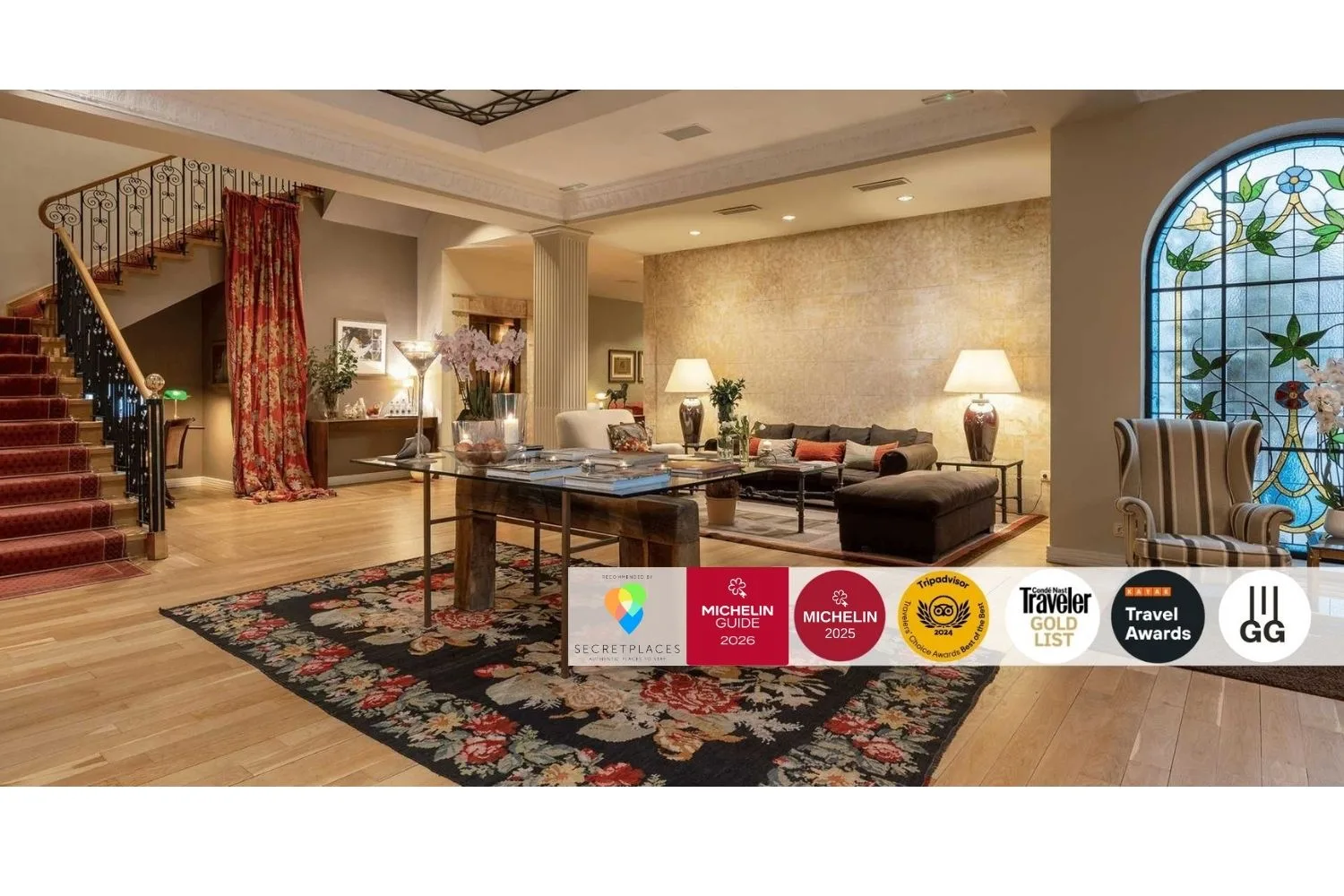 Representative hotel space: A hotel lounge with seating, a low table, and a staircase.