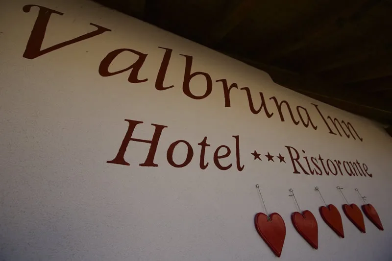 Representative hotel space: A wall displays the Valbruna Hotel and Ristorante name above red heart decorations.