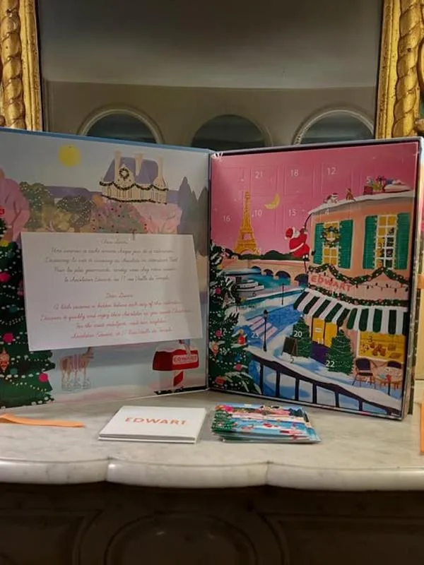 Representative hotel space: A marble counter displays illustrated holiday calendars and printed cards.