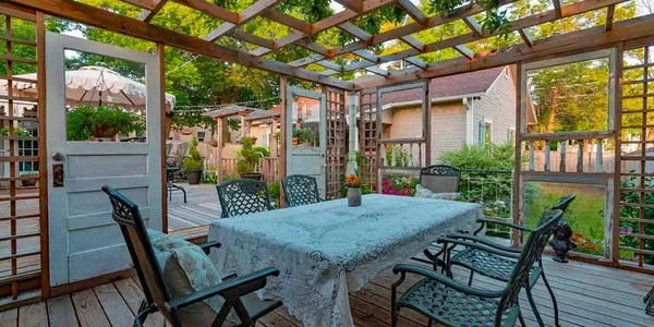 Representative hotel space: A covered outdoor dining area with a table and surrounding seating.