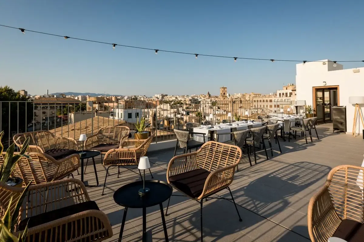 Representative hotel space: A rooftop terrace with outdoor seating and views across the city.