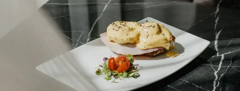 Representative hotel space: A plated meal with eggs and garnish sits on a countertop.