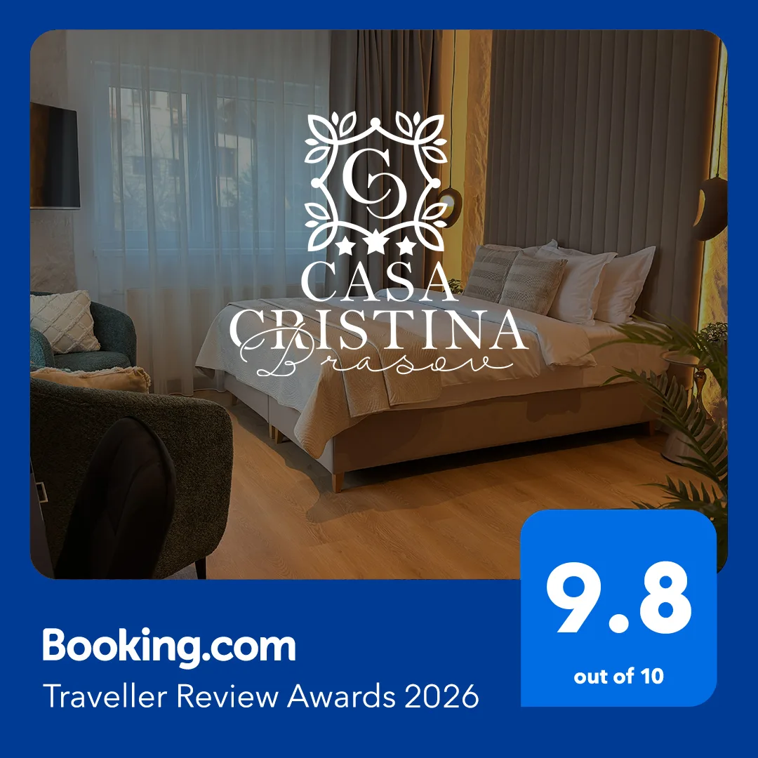Espacio representativo del hotel: Un dormitorio con una cama hecha y una zona de estar junto a la ventana.
