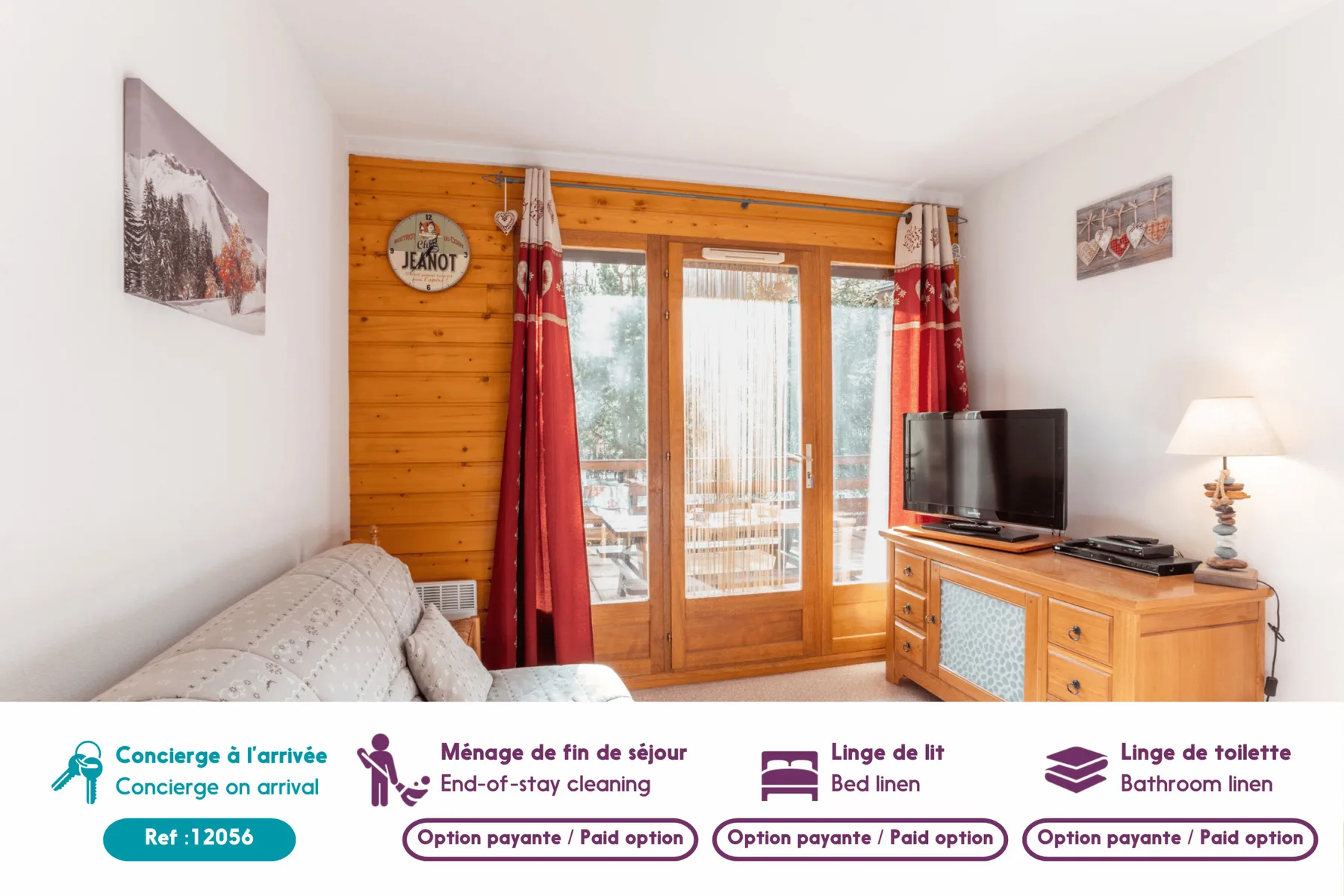 A bright bedroom with a wooden bed, red curtains, and a television.