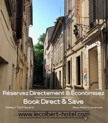 Representative hotel space: A narrow street runs between closely spaced stone buildings.