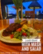 Representative hotel space: A plate of food sits on a table beside a sunlit window.
