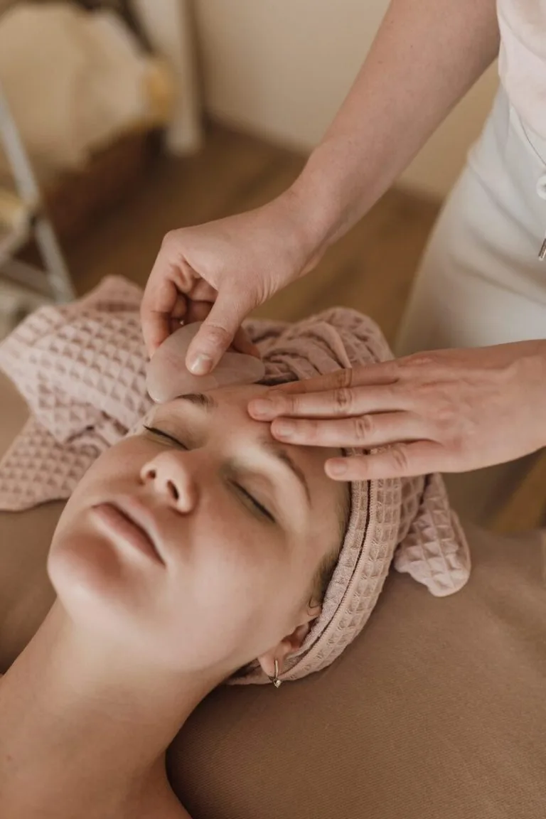 Representative hotel space: A person receives a facial treatment while reclining on a treatment bed.