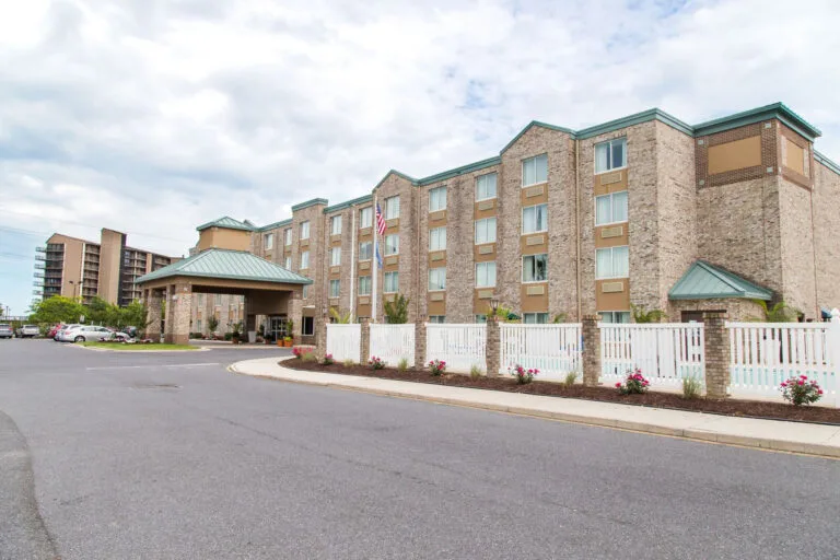 Representative hotel space: Hotel exterior with a covered entrance and a paved driveway.