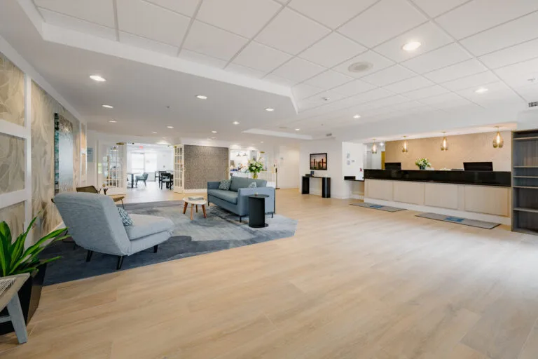 Representative hotel space: A spacious hotel lobby with seating and a long reception desk.