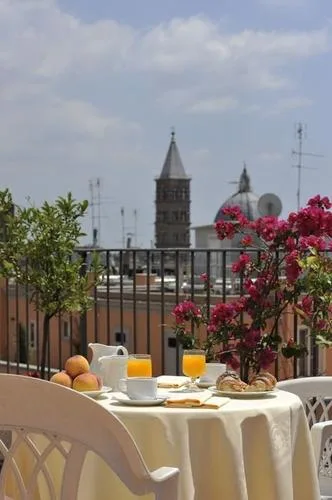 Representative hotel space: An outdoor dining table with breakfast overlooks a town skyline.