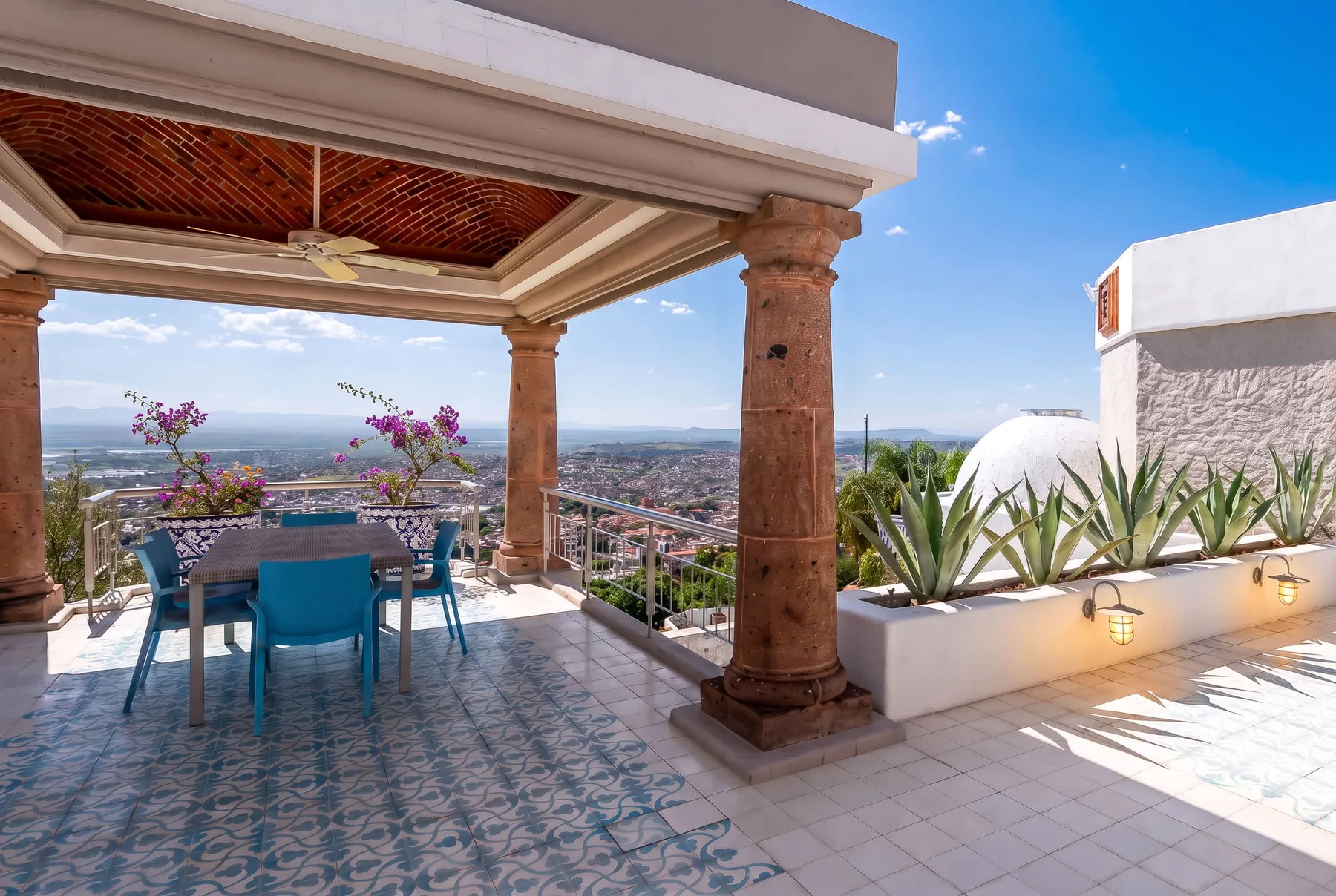 Shared amenity: A covered terrace with outdoor seating overlooks the surrounding landscape.
