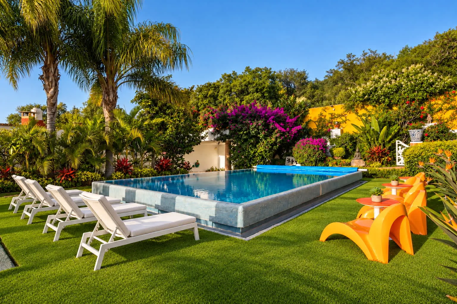 Shared amenity: An outdoor swimming pool is surrounded by lounge seating and greenery.