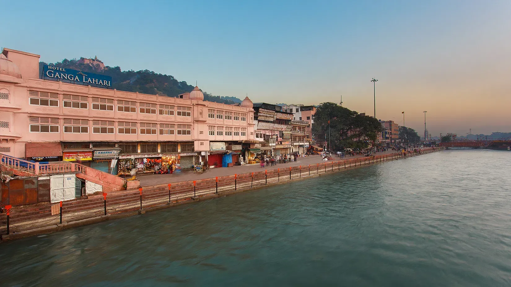 Representative hotel space: A riverside promenade runs past colorful buildings and shops.