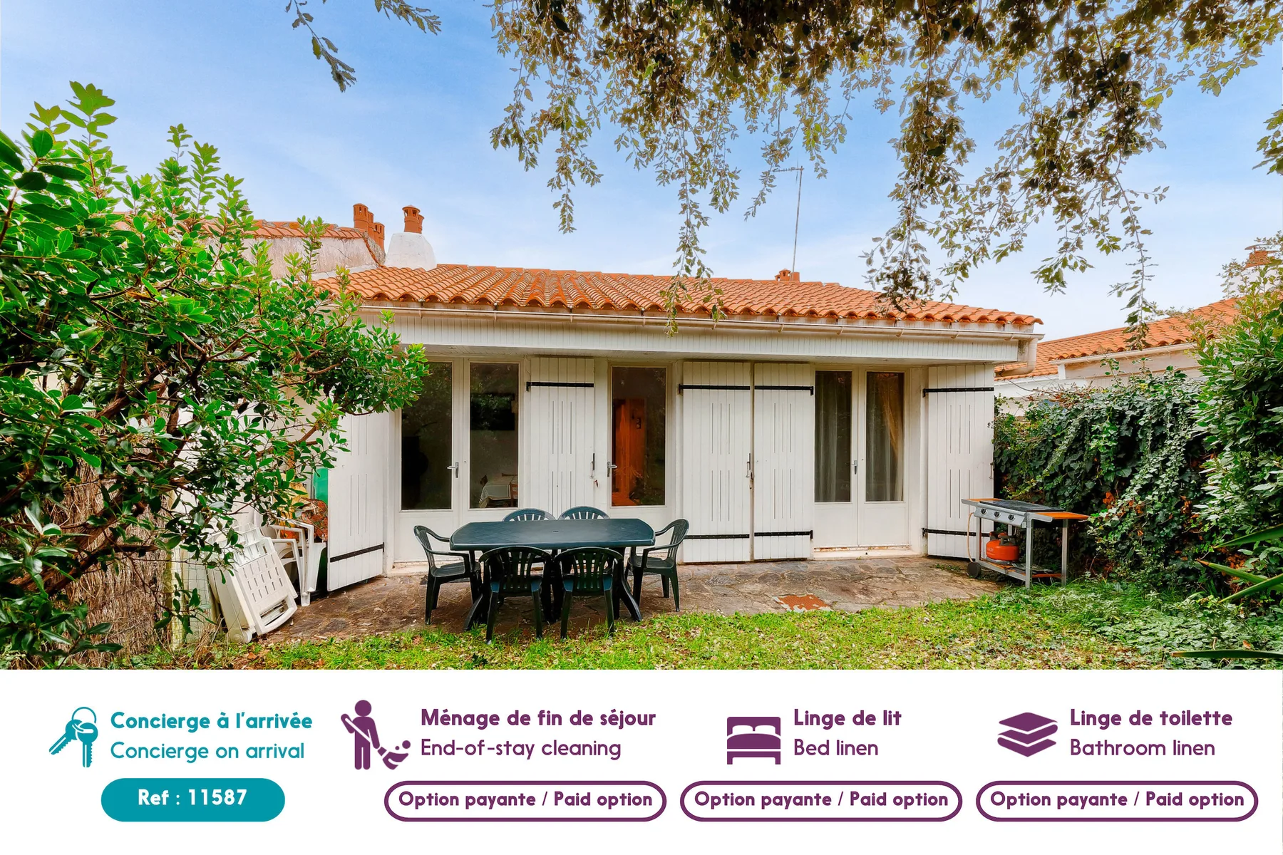 A single-story house with a tiled roof, patio seating, and leafy garden surroundings.