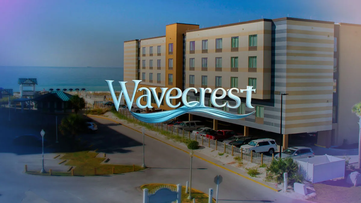 Representative hotel space: A multistory hotel building stands beside the coast.