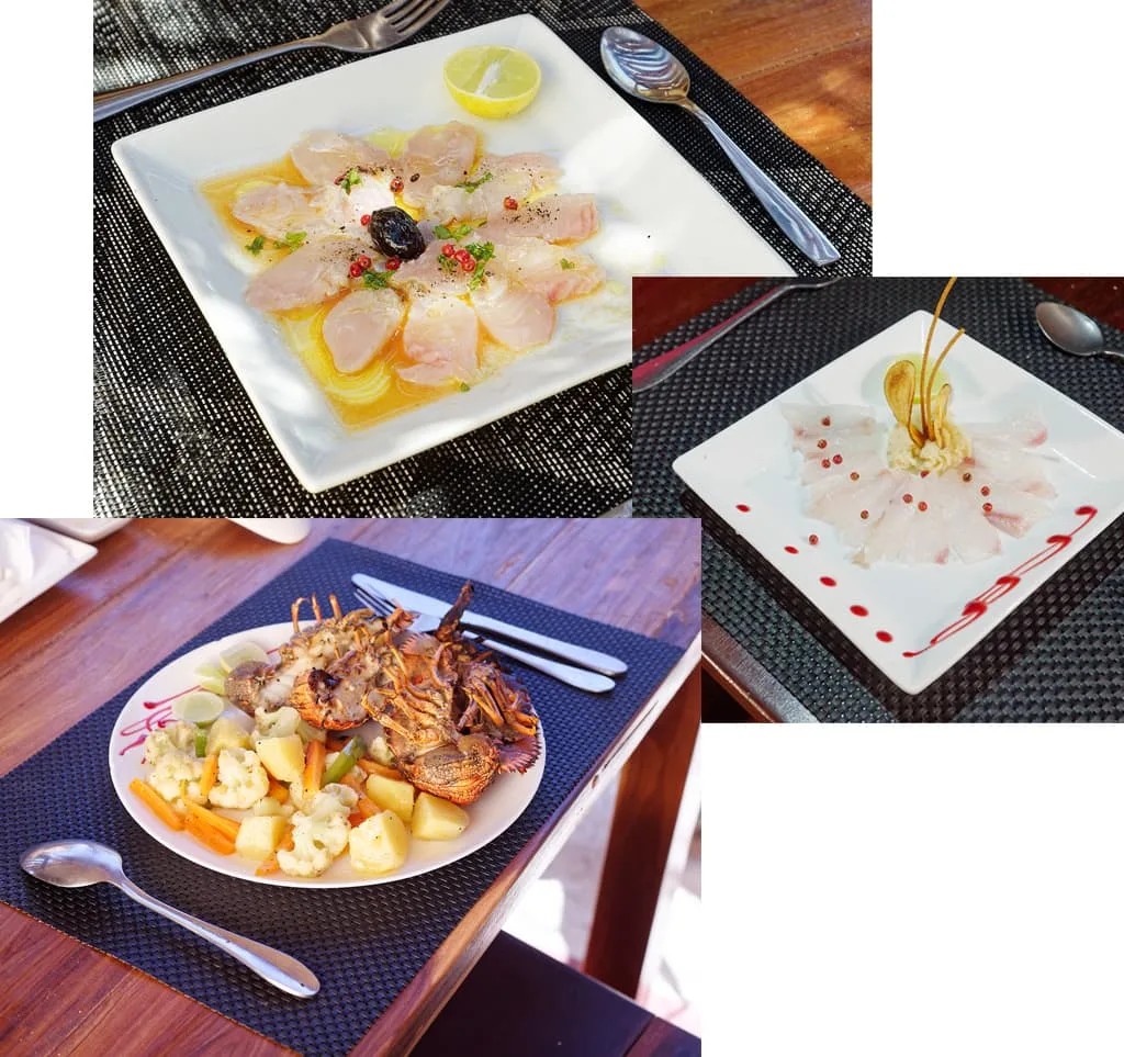 Espacio representativo del hotel: Un collage de platos de mariscos servidos sobre mesas de restaurante.