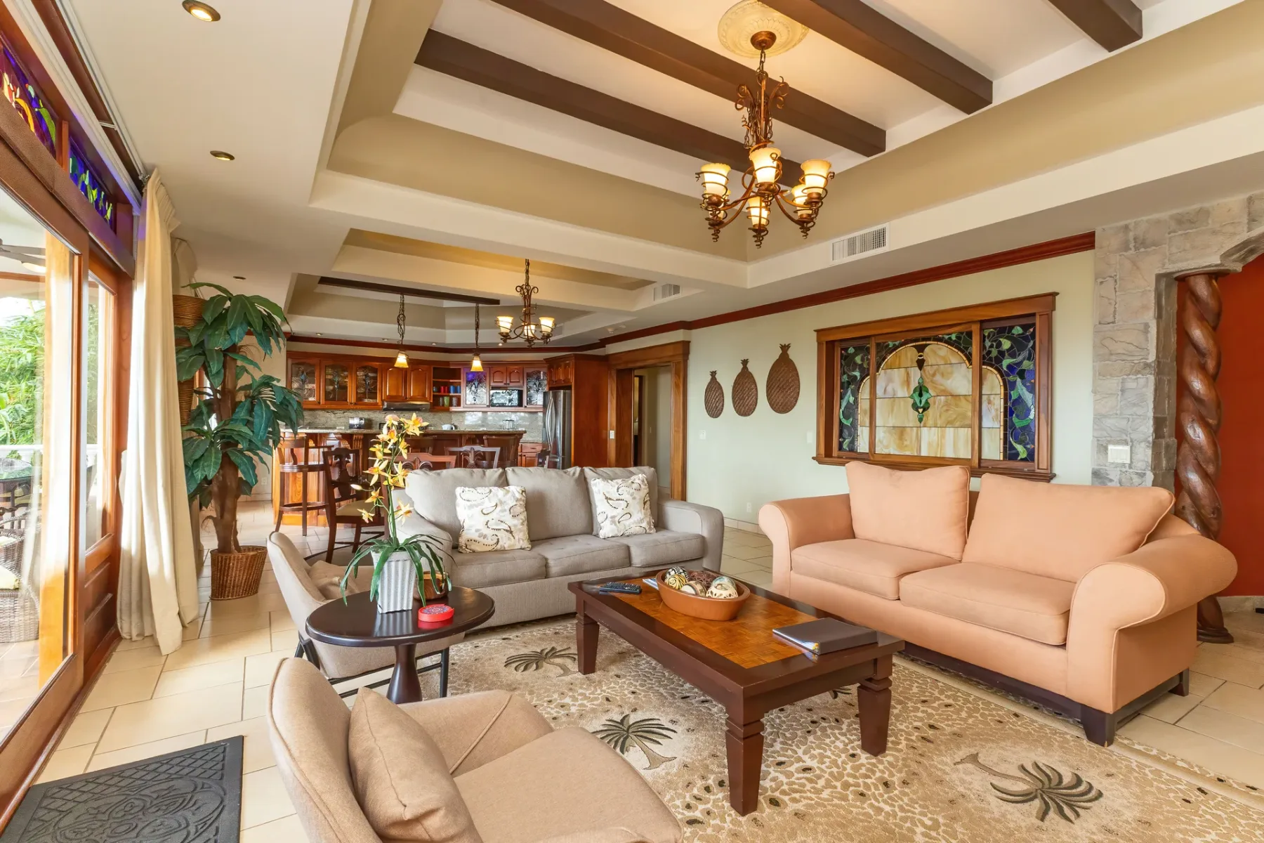 A living room with seating arranged around a wooden coffee table.