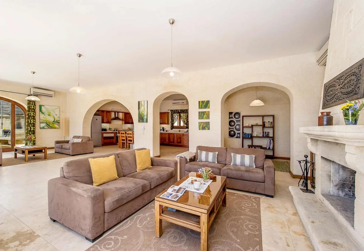 Living room area of luxury Gozo villa with pool