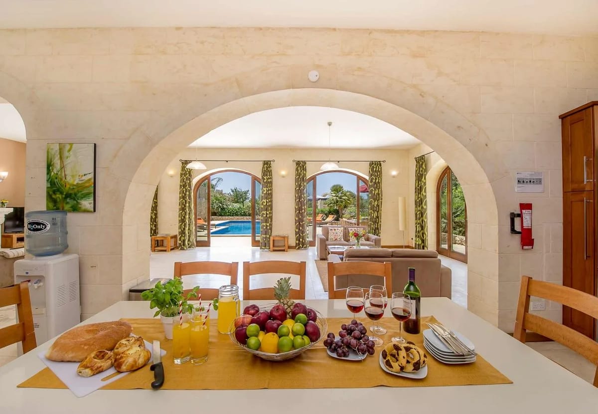 Dining room of The Olives Gozo farmhouse with pool