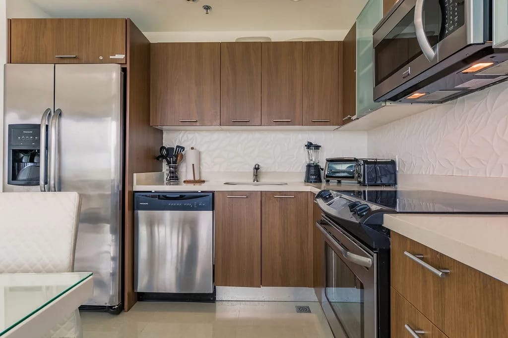 Your fully equipped kitchen features stainless appliances, modern cabinetry, and sleek countertops—everything you need to prepare meals at home during your stay.