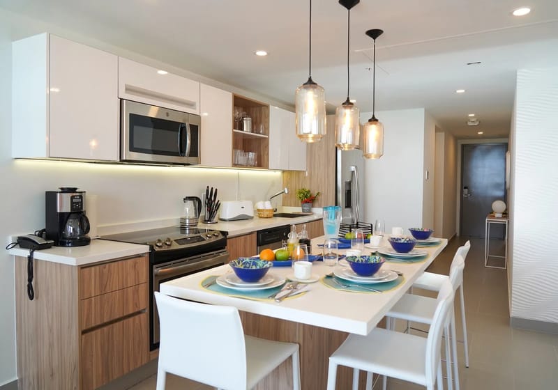 Bright, modern kitchen with appliances and an island for meals.
