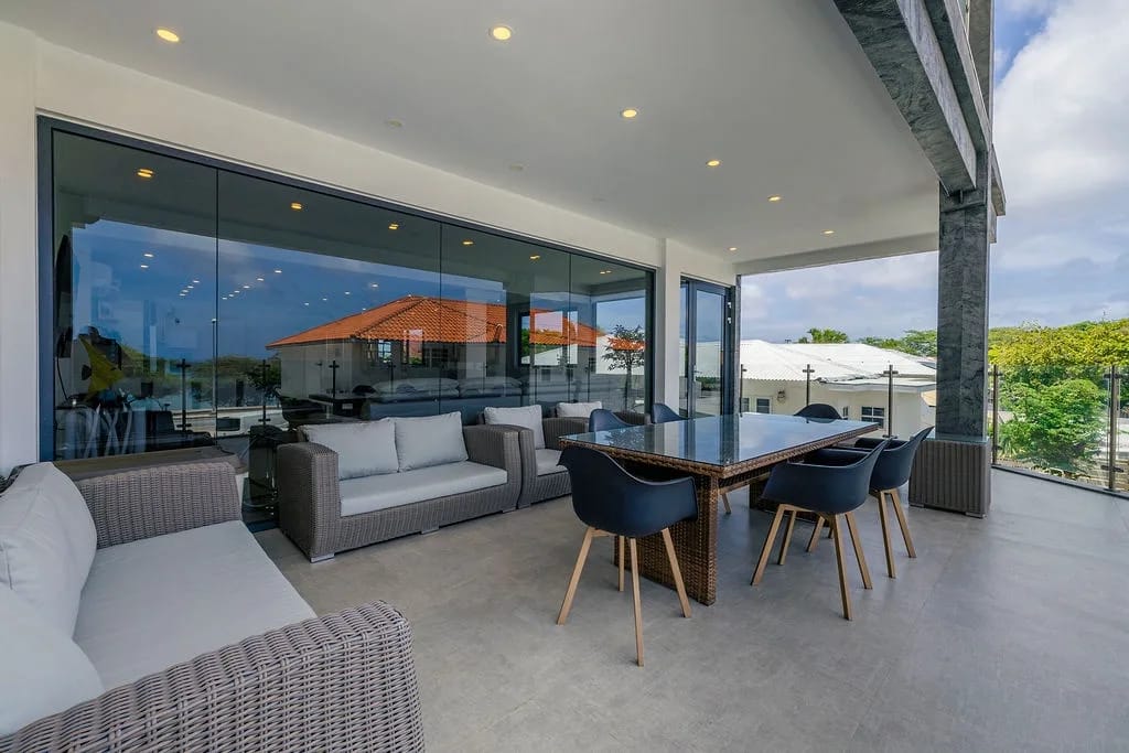 Relax or dine al fresco on your covered terrace, with plush seating and tropical views at every turn.