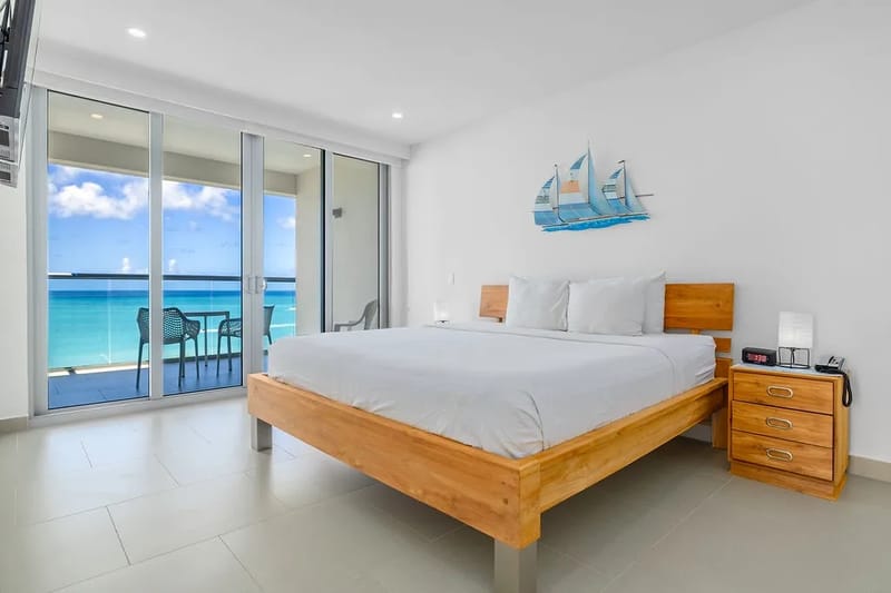 Bed with ocean views and a private balcony