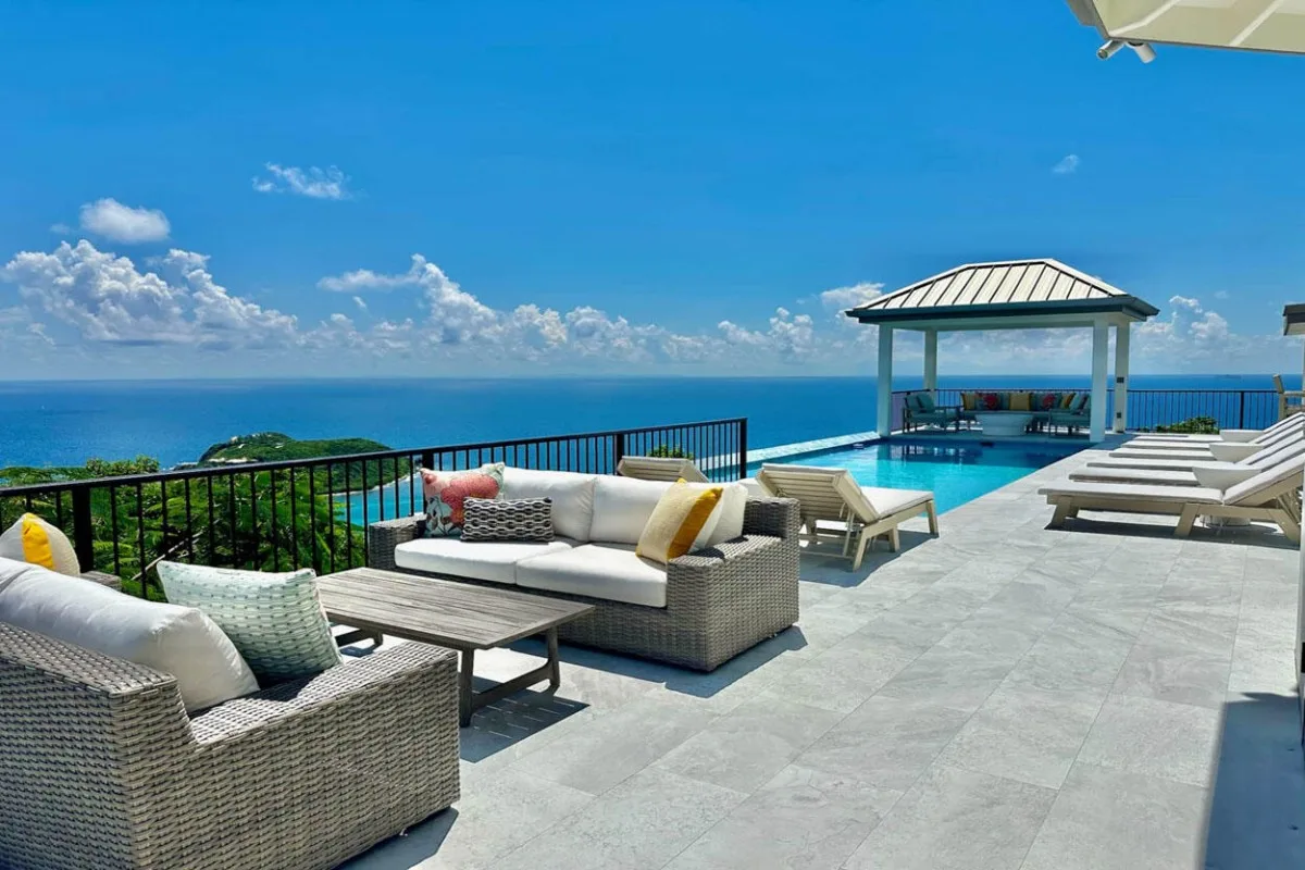 An ocean-view terrace has outdoor seating and a covered pavilion.