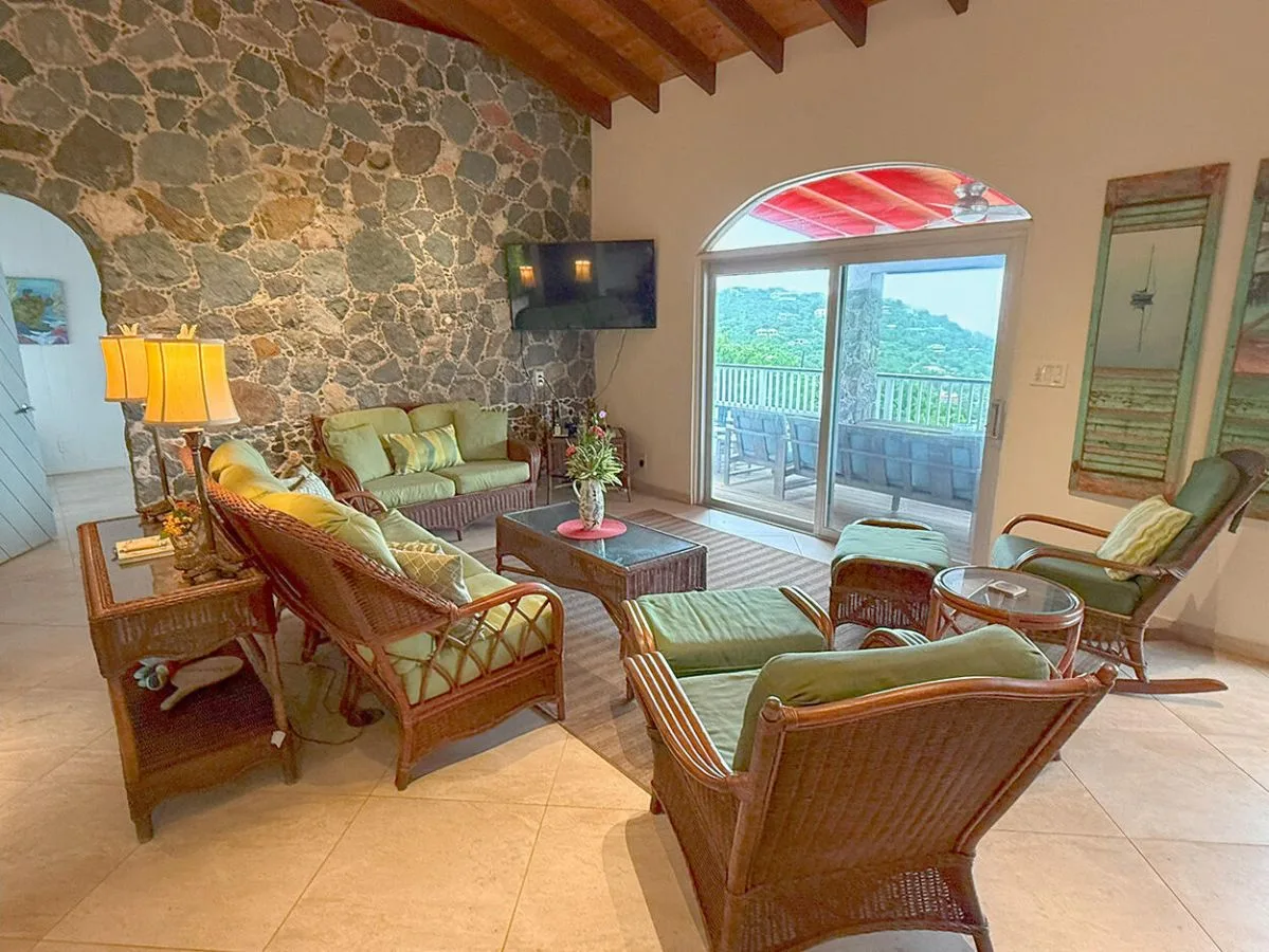 Living room opening to the partially covered deck