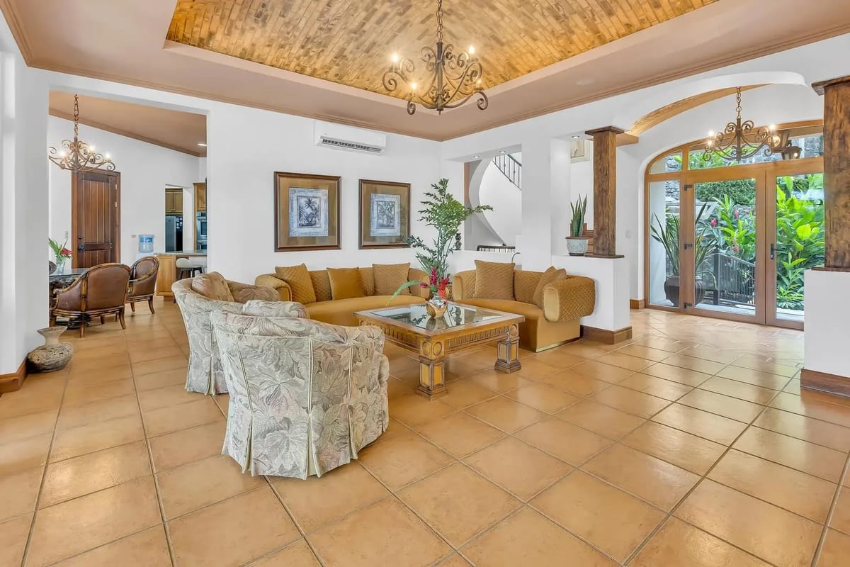 Spacious living room with elegant seating at a luxury beachfront villa in Playa Tambor, Costa Rica.