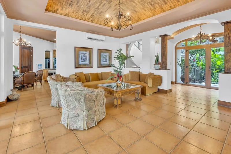 Spacious living room with elegant seating at a luxury beachfront villa in Playa Tambor, Costa Rica.