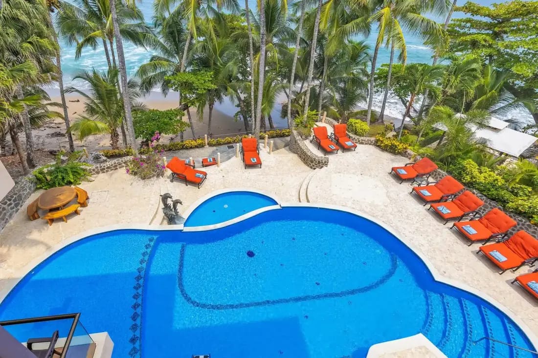 Private beachfront swimming pool overlooking Playa Tambor at a luxury villa on Costa Rica's Nicoya Peninsula.