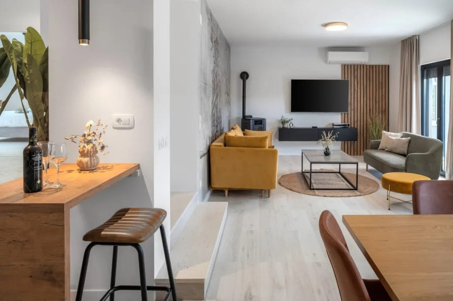 Living room with convertible sofa, TV and PlayStation 5