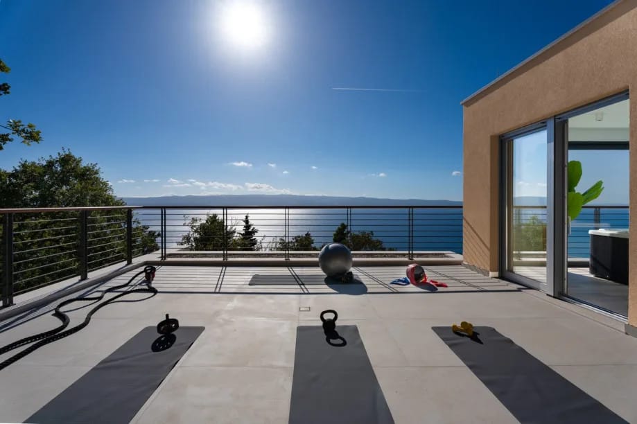 Outdoor treadmill, fitness mats and weights on the east terrace.