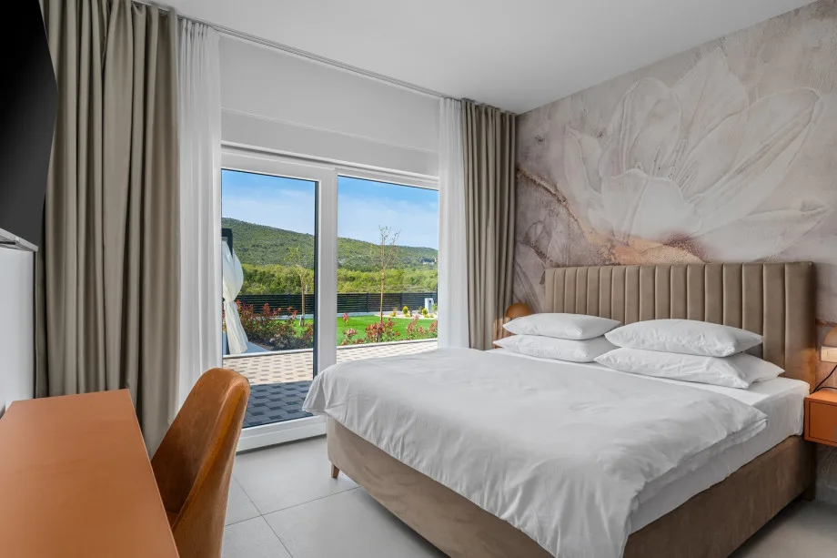 Bedroom 1 with a king-size bed and en-suite bathroom
