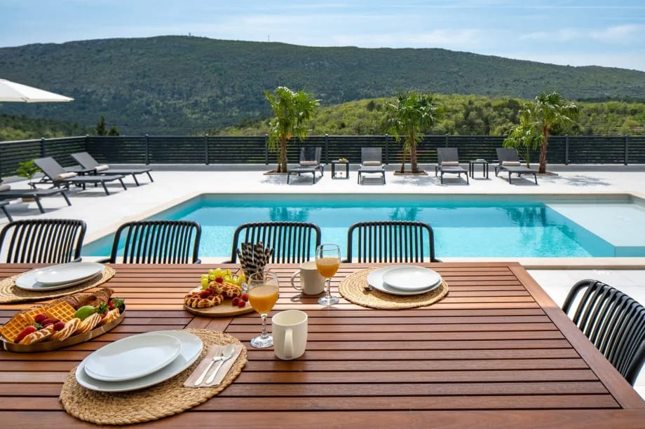 Covered outdoor dining table with seating for ten